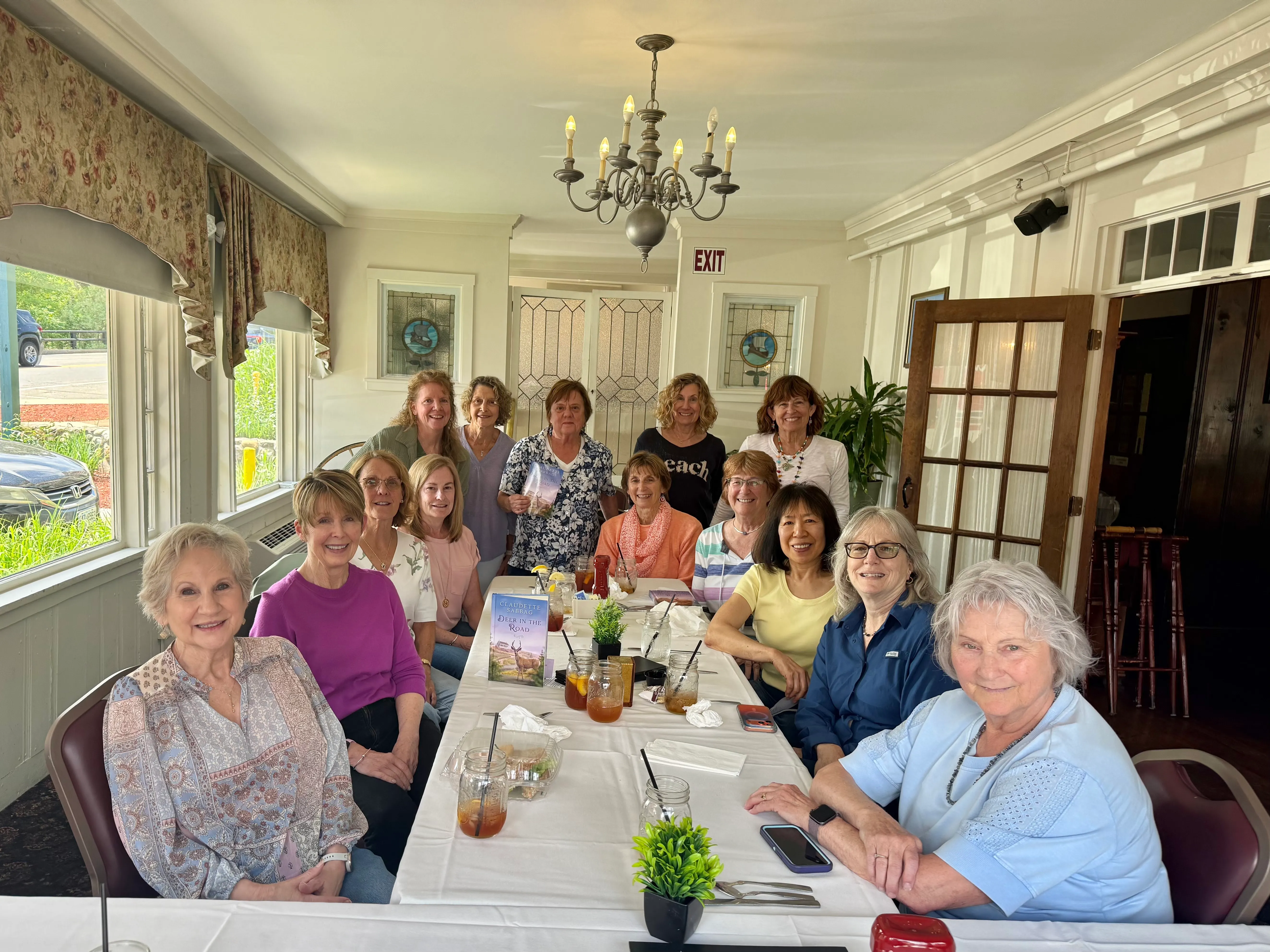 The Dover, NH book club gathered around a table